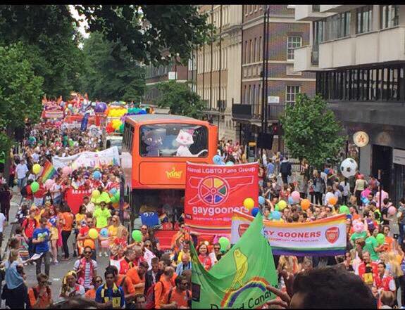 A photo of the Parade at Pride in London showing various LGBT+ Fans Groups taking part