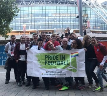 LGBT+ fans repping members of Pride in Football outside Wembley Stadium at England v Slovakia